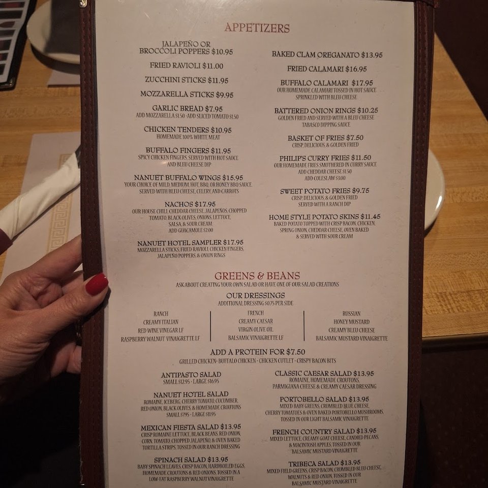Printed menu with appetizers and pizza.